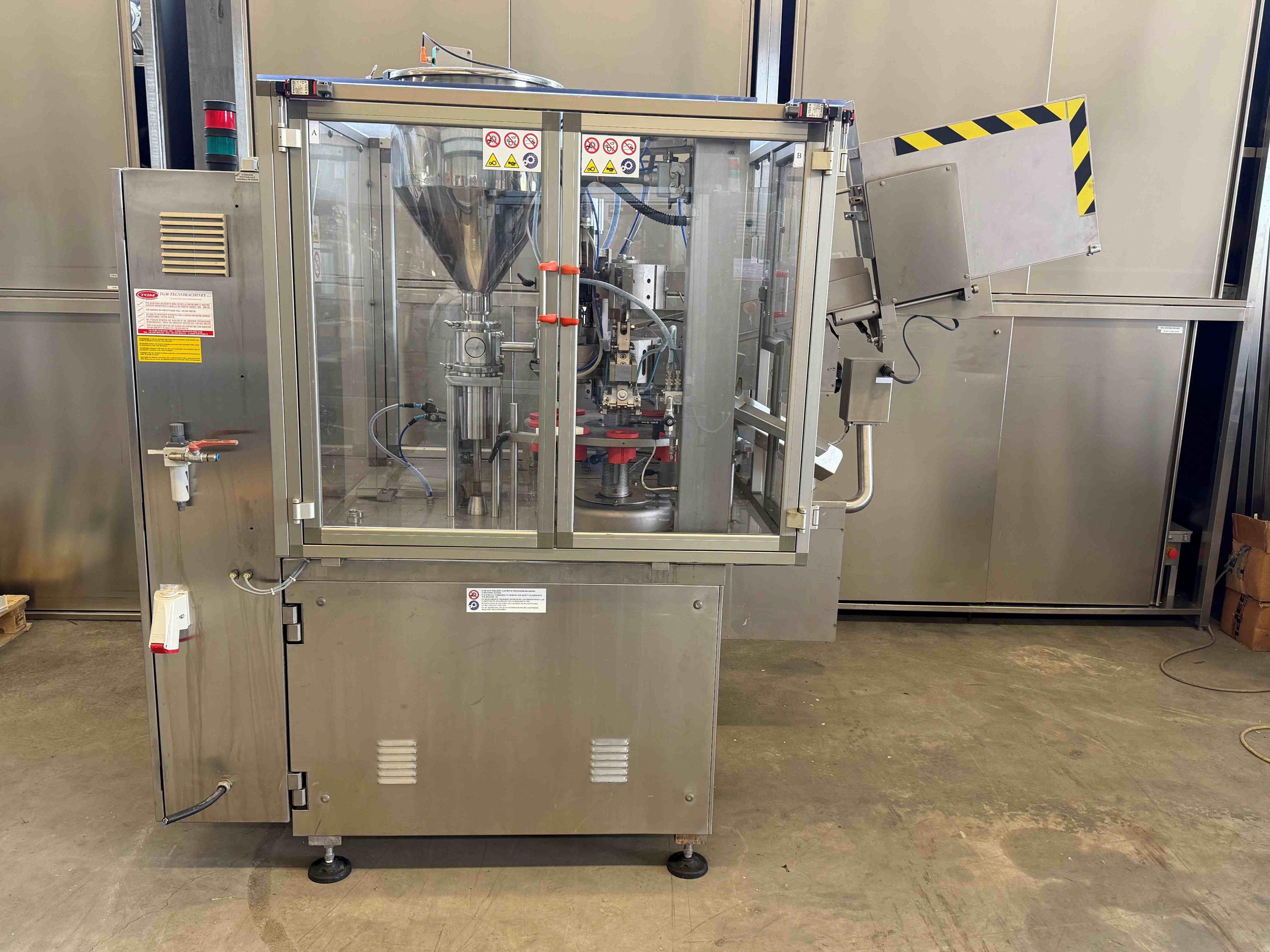 Tube filling and capping machine